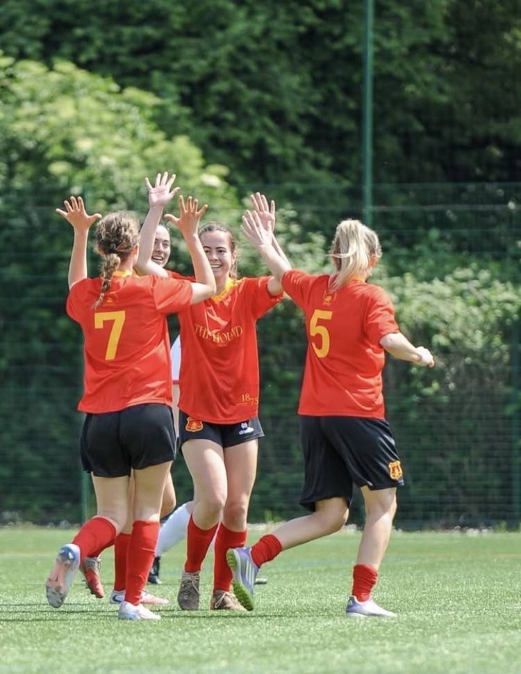 Polytechnic Women’s XI players celebrating a goal